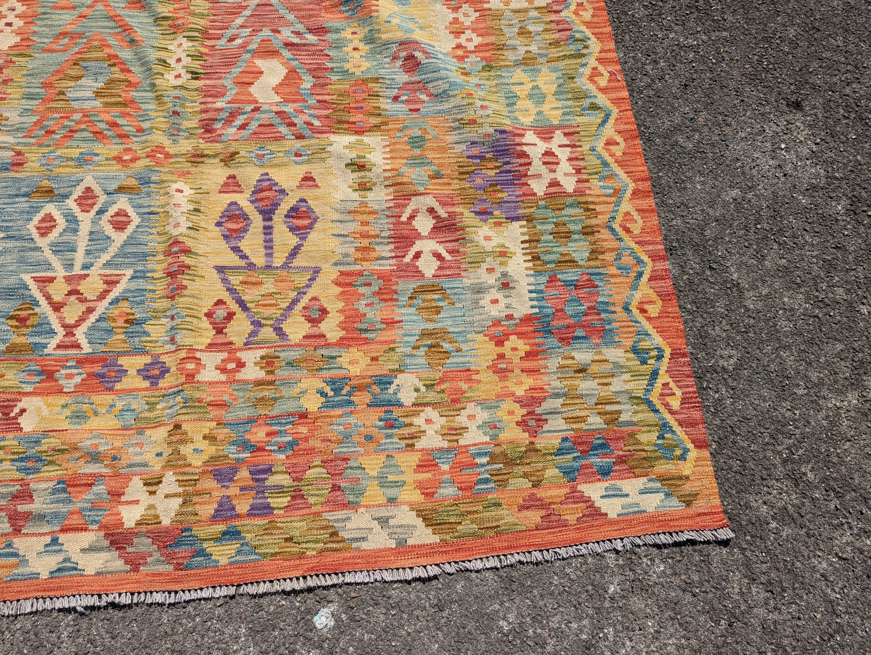 An Anatolian polychrome geometric flatweave Kilim carpet, 290 x 210cm